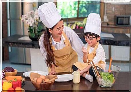 A mother who cooks with her child.