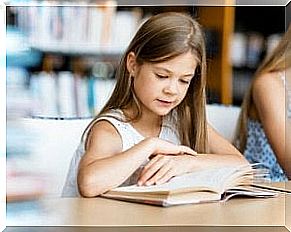 A little girl reading.