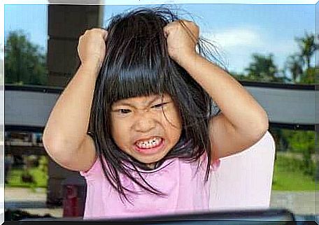 A girl having a temper tantrum.