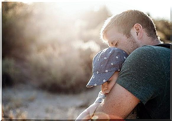 Baby in her daddy's arms