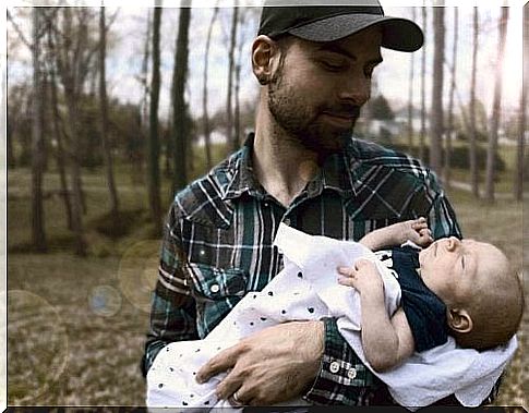 father with his newborn baby