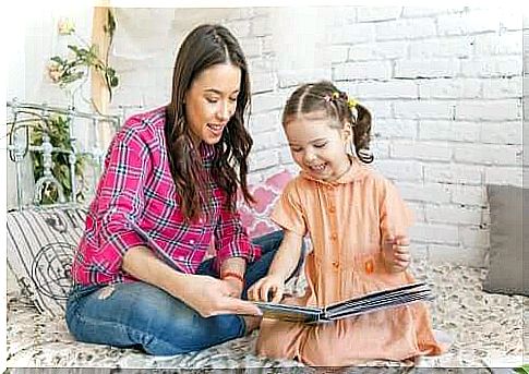 mother reading a fairy tale to her daughter