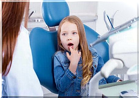 A young girl at the dentist. 