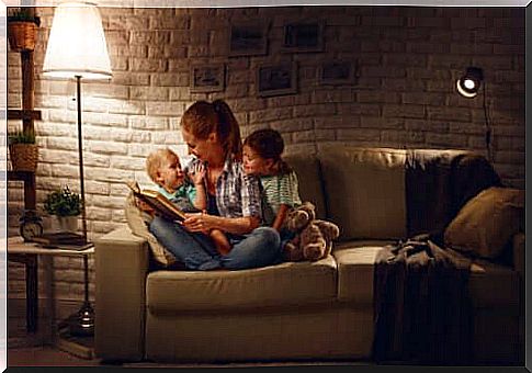 A mother who reads traditional tales to children before sleeping.