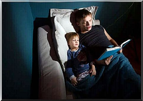 A father reading the tales of the Brothers Grimm to his son.