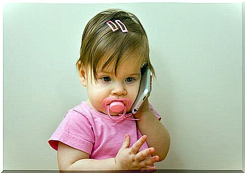 A little girl who wants to talk on the phone