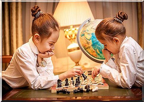 Two girls playing chess.