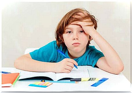 A child tired of his homework.