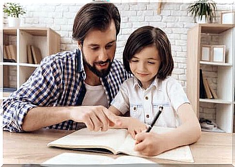 father and daughter doing homework