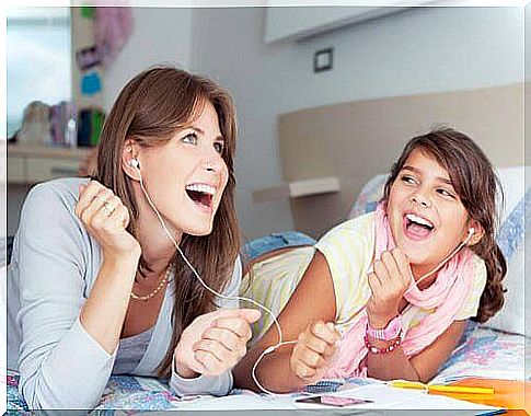 mother and daughter listening to music together