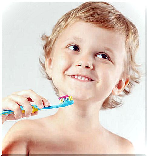 A child brushing his teeth. 