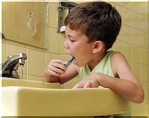 A young boy brushing his teeth. 