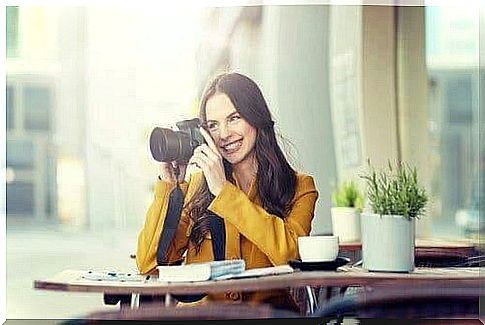 A woman taking photographs.