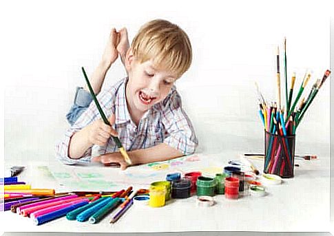 A child who paints draws and colors.