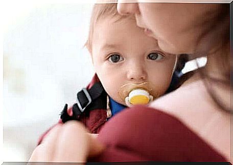 A baby with his pacifier.