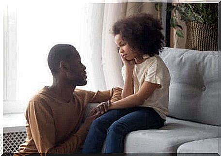 A father talking to his daughter.