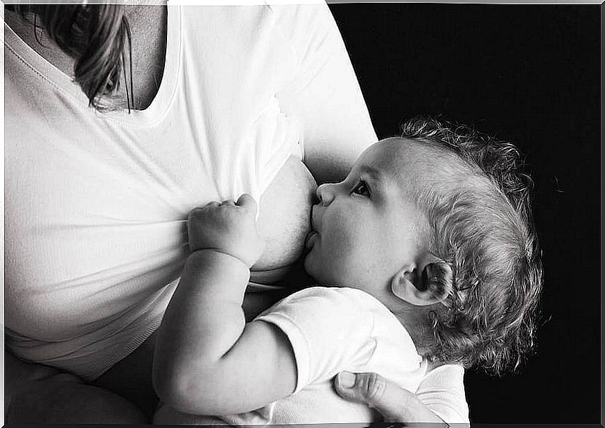 A mother breastfeeding her baby. 