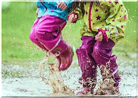 Children playing in the mud.