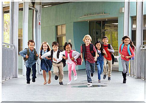 Back to school with children with the schoolbag on their back.