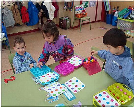 Children play in a classroom