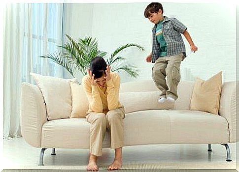 Child jumps on sofa to get attention